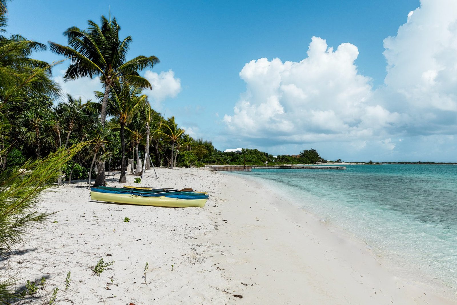 Kayaks on the beach beside the villa