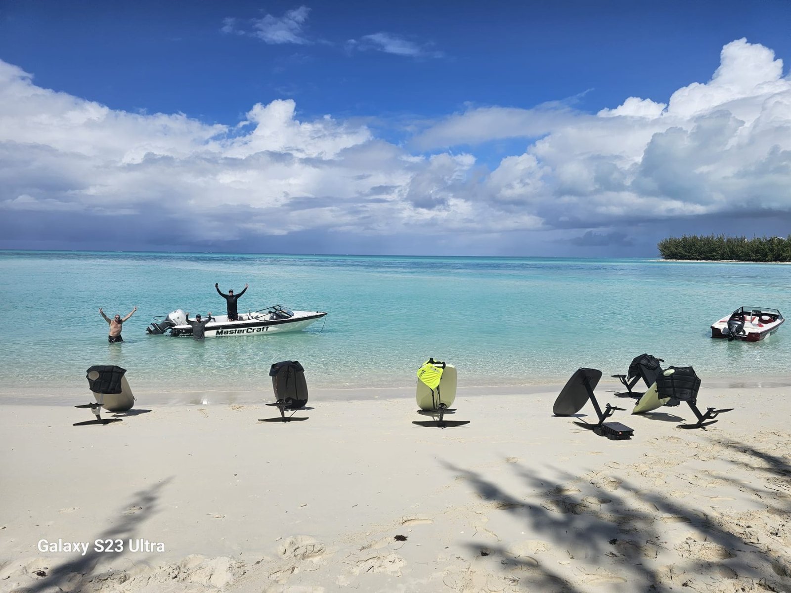 Fliteboards lined up on the sand with the Mastercraft offshore
